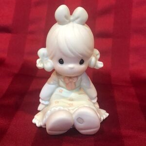 Adorable Figurine with Bow